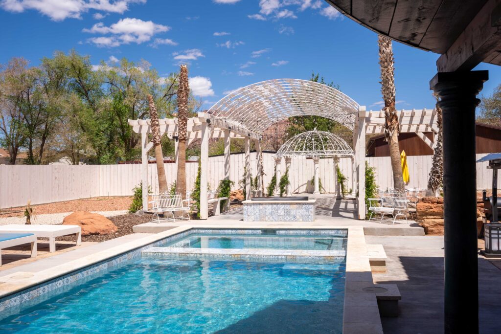 beautiful salt water pool and spa with a fireplace